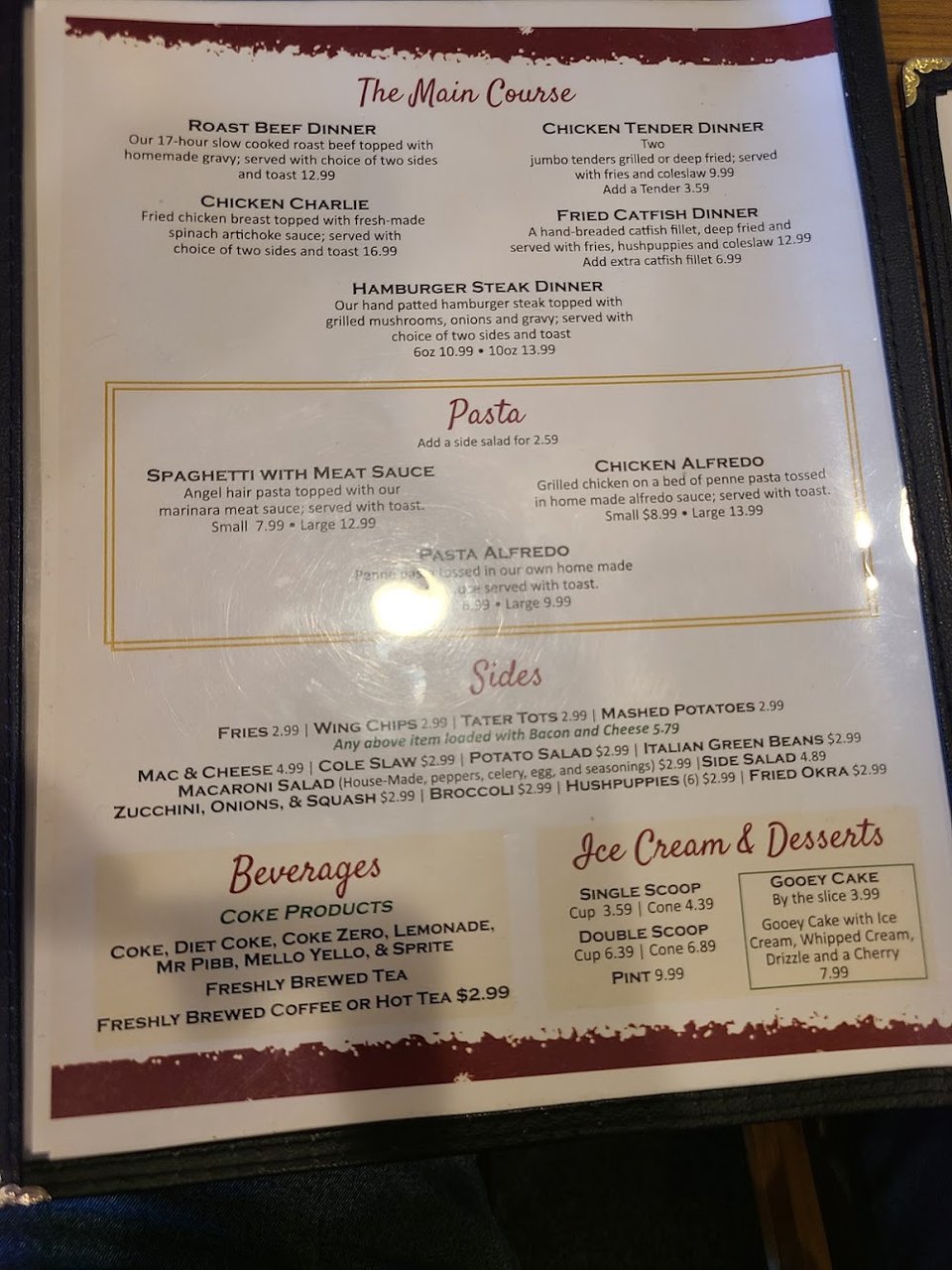 Printed menu with burgers, wings, and dessert sections.